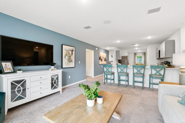 The open concept living and dining areas of the Sylvester floorplan from the Value collection by Holiday Builders.