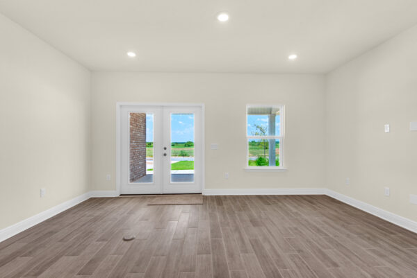 The living area of the Bay floorplan from the Cornerstone Collection by Holiday Builders.