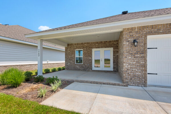 The outdoor living area of the Bay floorplan from the Cornerstone Collection by Holiday Builders.