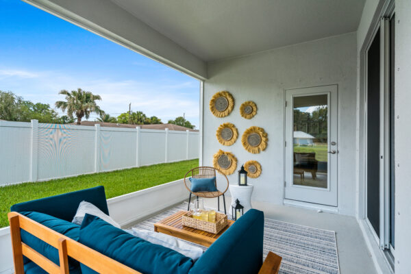 The outdoor covered lanai of the Biscayne floorplan from the Cornerstone collection by Holiday Builders.