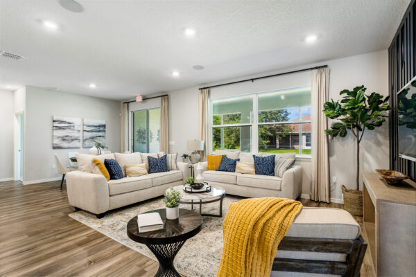 The spacious living area in the Captiva floorplan from the Cornerstone collection by Holiday Builders.