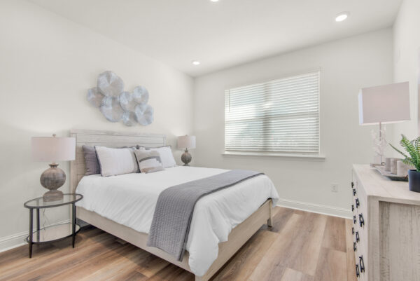 The guest bedroom in the Carlton floorplan from the Cornerstone collection by Holiday Builders.