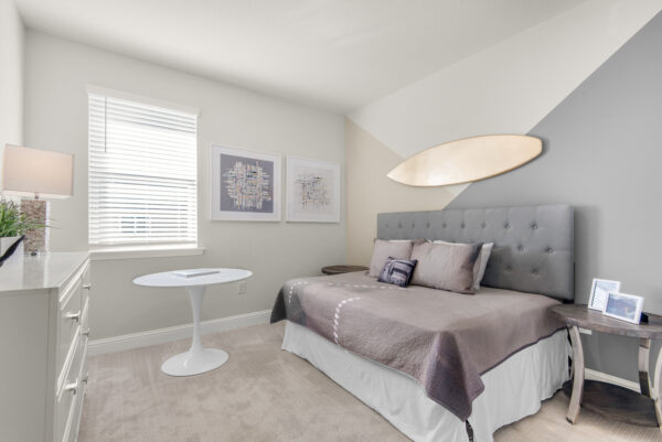 Another guest bedroom in the Carlton floorplan from the Cornerstone collection by Holiday Builders.