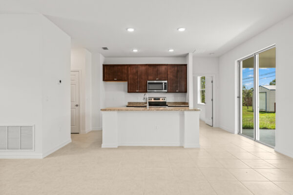 The kitchen in the Clearwater floorplan from the Cornerstone collection by Holiday Builders.