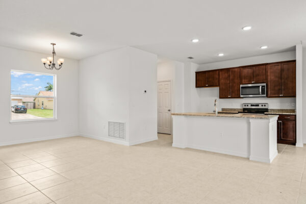 The kitchen and dining area in the Clearwater floorplan from the Cornerstone collection by Holiday Builders.