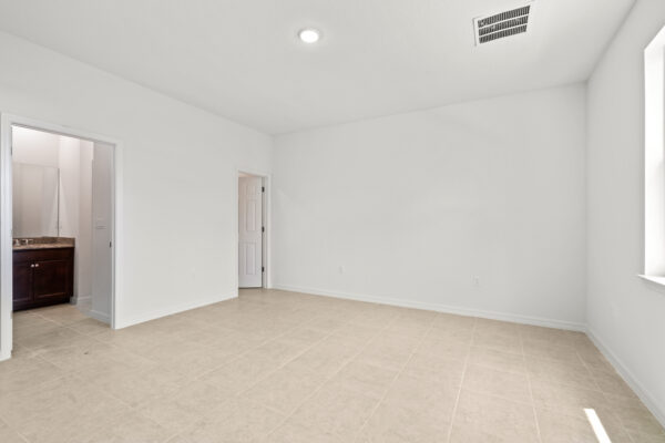 The master bedroom in the Clearwater floorplan from the Cornerstone collection by Holiday Builders.