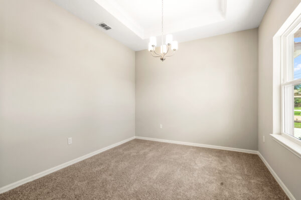 The dining area in the Delray floorplan from the Cornerstone collection by Holiday Builders.