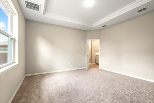 The master bedroom in the Delray floorplan from the Cornerstone collection by Holiday Builders.