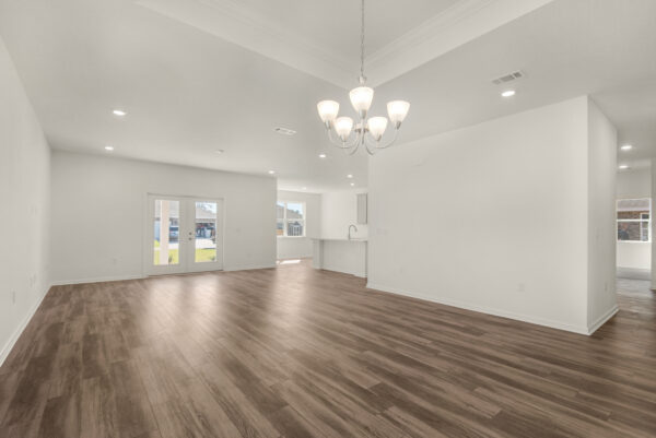 The dining and living areas in the Dora floorplan from the Cornerstone collection by Holiday Builders.