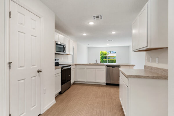 The kitchen in the Foxtail from the Value collection by Holiday Builders.