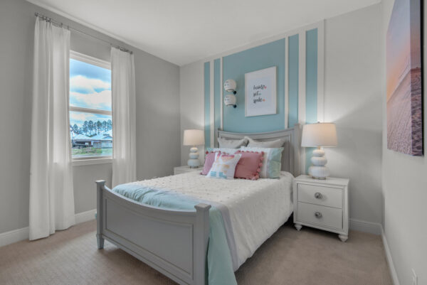 A girl's bedroom in the Hamilton floorplan from the Cornerstone collection by Holiday Builders.