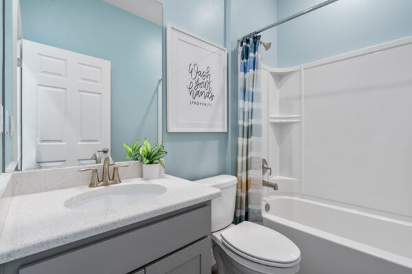 The guest bath in the Highland floorplan from the Cornerstone collection by Holiday Builders.
