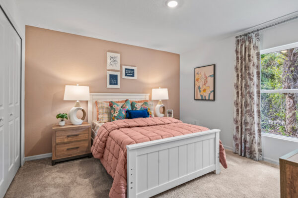 A girl's bedroom in the Majestic floorplan from the Holiday Builders Value Collection