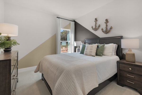 The guest bedroom in the Navarre floorplan from the Cornerstone collection by Holiday Builders.