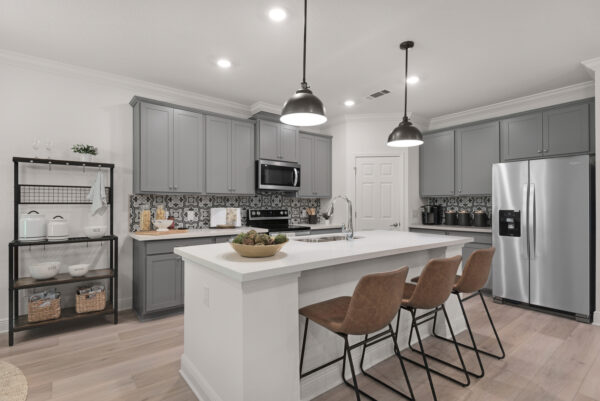 The kitchen in the Navarre floorplan from the Cornerstone collection by Holiday Builders.