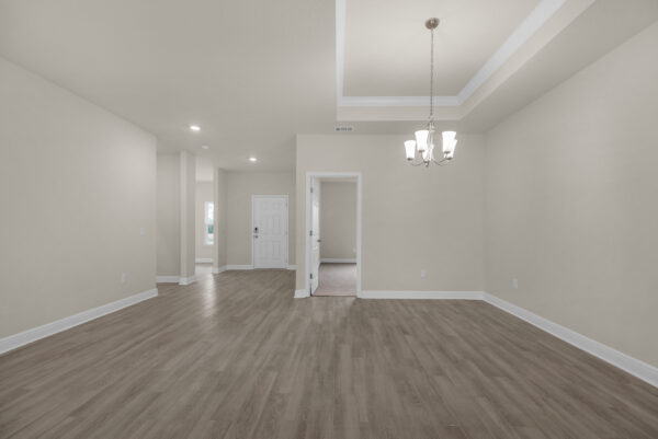 The living area in the Osprey Floorplan from the Cornerstone Collection by Holiday Builders.