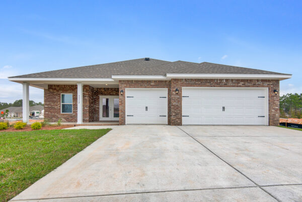 The rear entry garage of the Osprey Floorplan from the Cornerstone Collection by Holiday Builders.