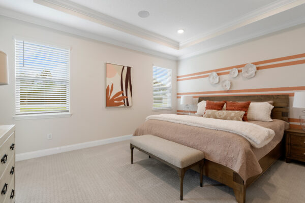 The generous owners' suite in the Charlotte floorplan by Holidaty Builders in Palm Coast