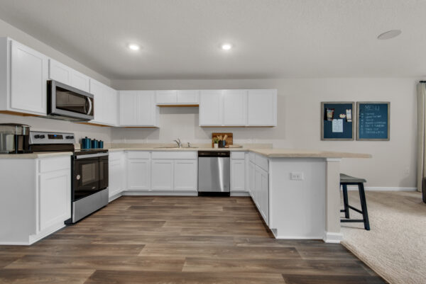 The kitchen in the Palmer floorplan from the Value collection by Holiday Builders.