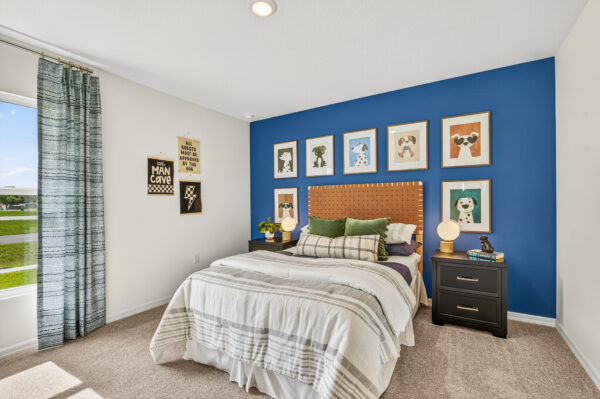 A boy's bedroom in the Queen floorplan from the Value Collection by Holiday Builders