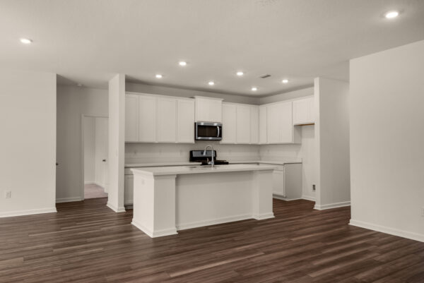 The kitchen in the Rosemary floorplan from the Cornerstone collection by Holiday Builders.