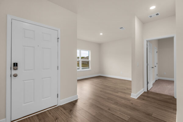The front entry in the Rosemary floorplan from the Cornerstone Collection by Holiday Builders.