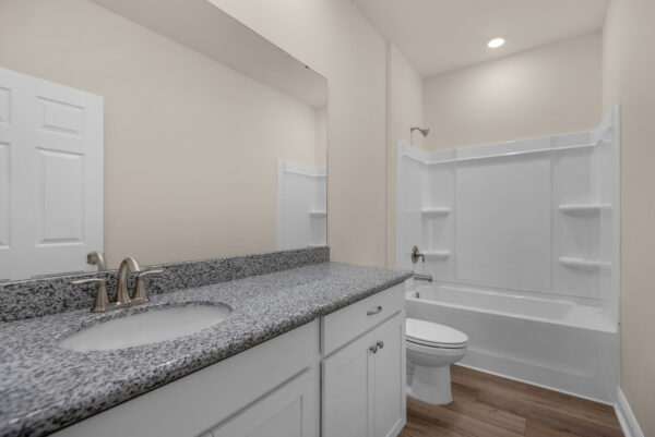 The guest bath in the Rosemary floorplan from the Cornerstone Collection by Holiday Builders.
