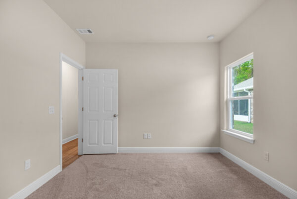 The guest bedroom 2 in the Rosemary floorplan from the Cornerstone Collection by Holiday Builders.