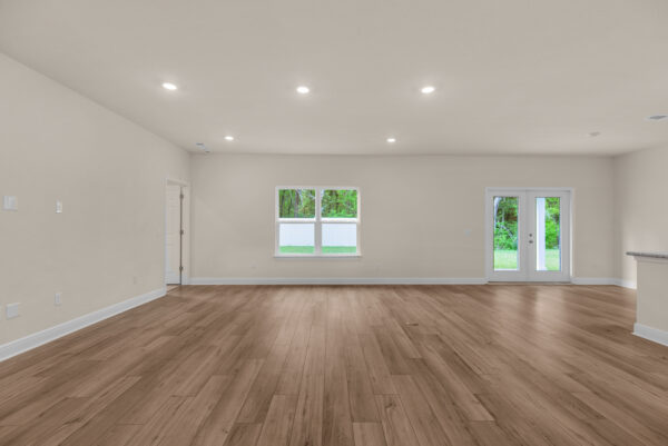 The living area in the Rosemary floorplan from the Cornerstone Collection by Holiday Builders.