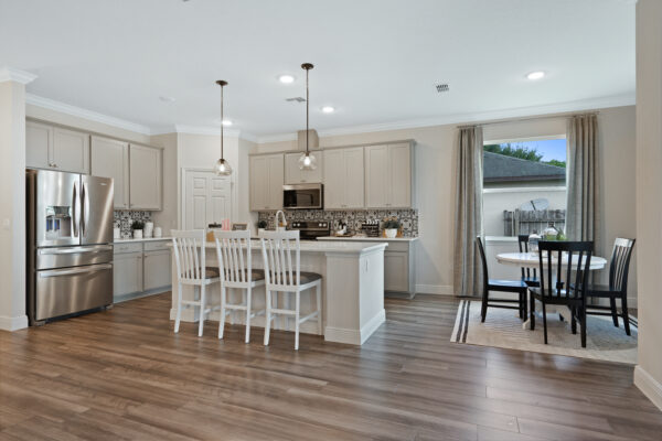 The kitchen in the Sanibel floorplan from the Cornerstone collection by Holiday Builders.