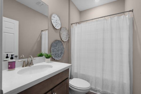 The guest bath in the Santa Rosa floorplan from the Cornerstone collection by Holiday Builders.
