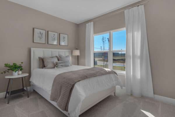 The guest bedroom in the Santa Rosa floorplan from the Cornerstone collection by Holiday Builders.