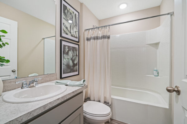 The guest bath in the Sylvester floorplan from the Value collection by Holiday Builders.