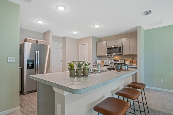 The kitchen in the Sylvester floorplan from the Value collection by Holiday Builders.