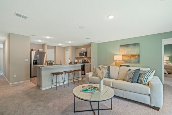 The living to kitchen area in the Sylvester floorplan from the Value collection by Holiday Builders.