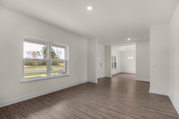 The entry and den in the Walton floorplan from the Cornerstone Collection by Holiday Builders.