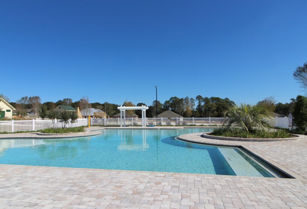 The community pool at Yellow River Ranch in Milton, Florida with homes by Holiday Builders.