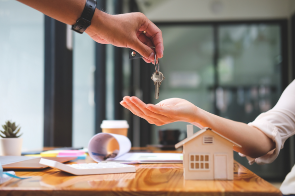 Getting the keys to your new home at closing. 